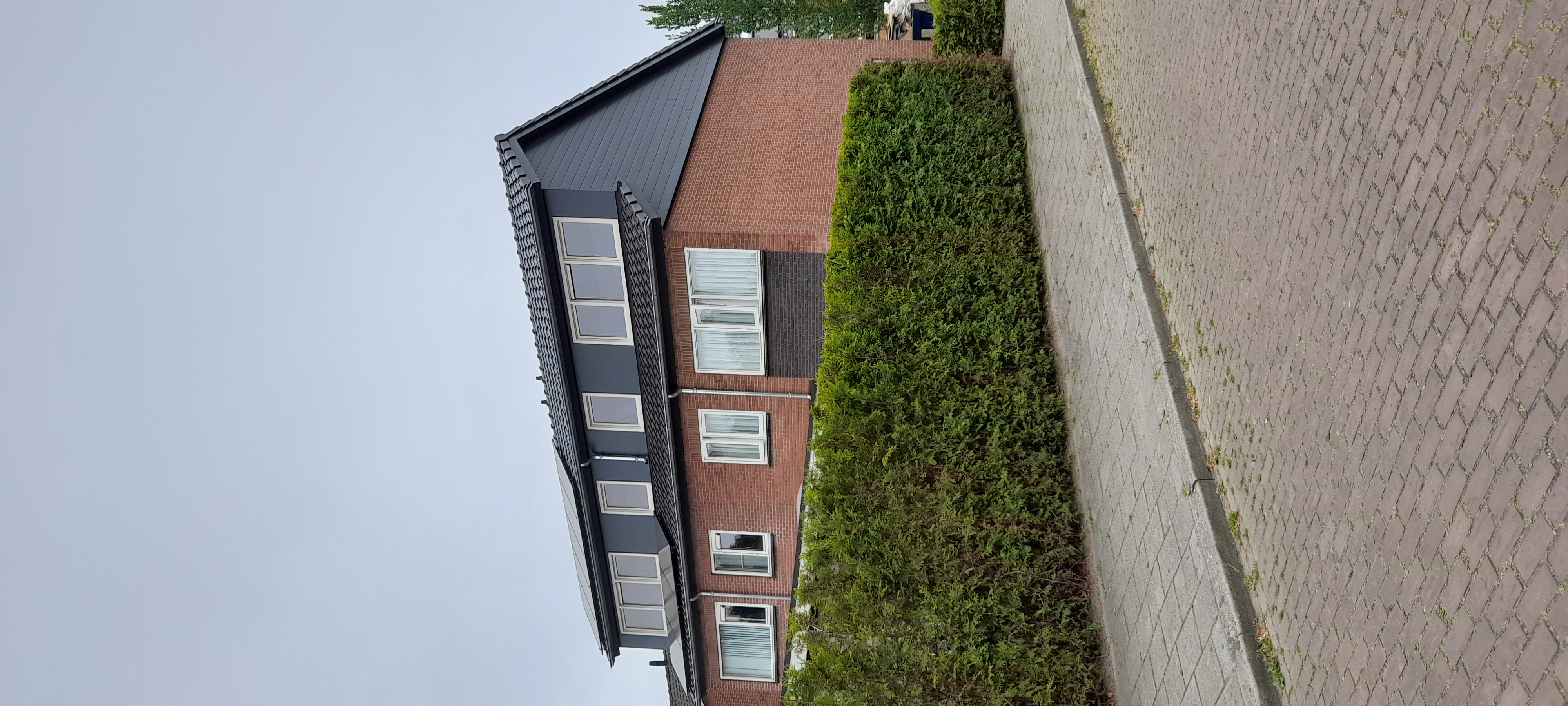 Restauratie en verduurzaming hellend dak en dakkapellen Rossum foto